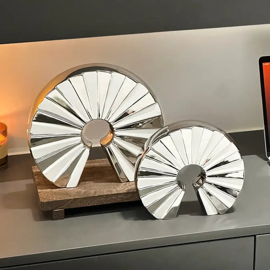Shiny metallic chrome geometric ceramic fan ornament with reflective finish for living room decor by decorbites