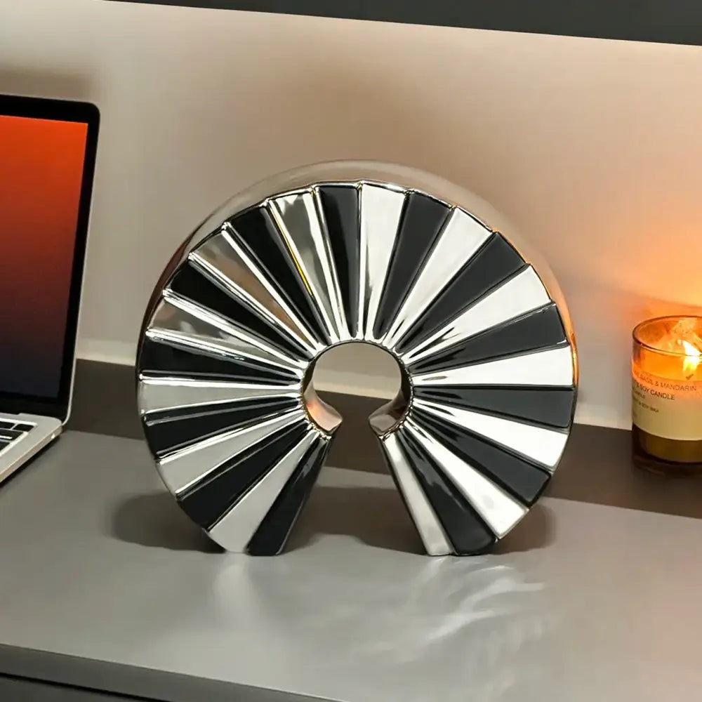 Shiny black and silver decorbites geometric ceramic fan ornament with a sleek modern design for living room decor