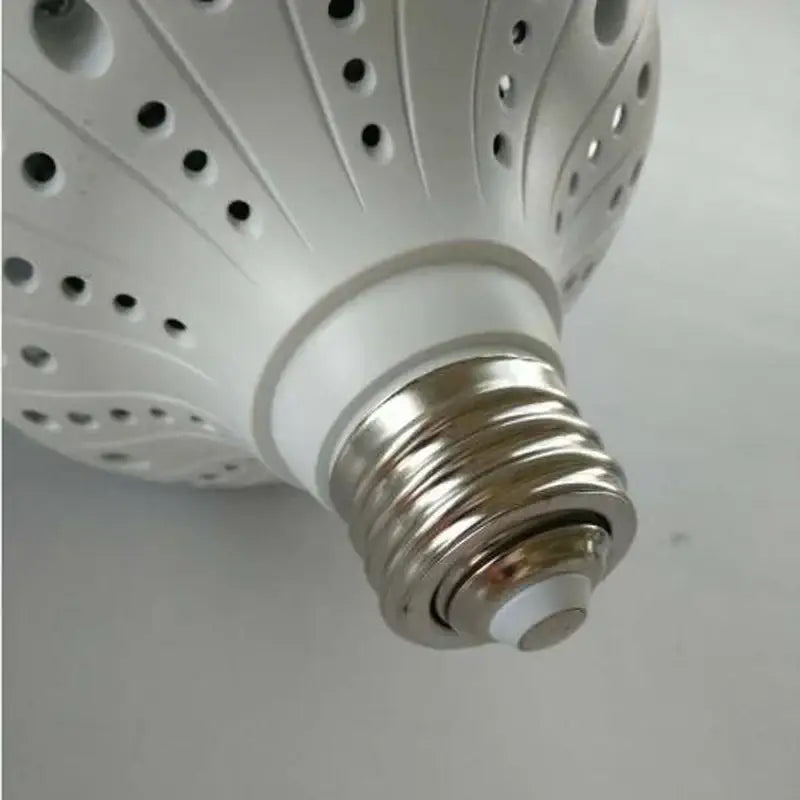 White led bulb with textured perforated design and metallic screw base for e40 lamp holder garage workshop lighting