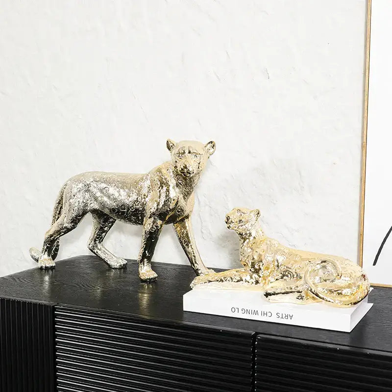 Two metallic gold and silver leopard resin sculpture figurines on white base for living room decorbites leopard resin decor
