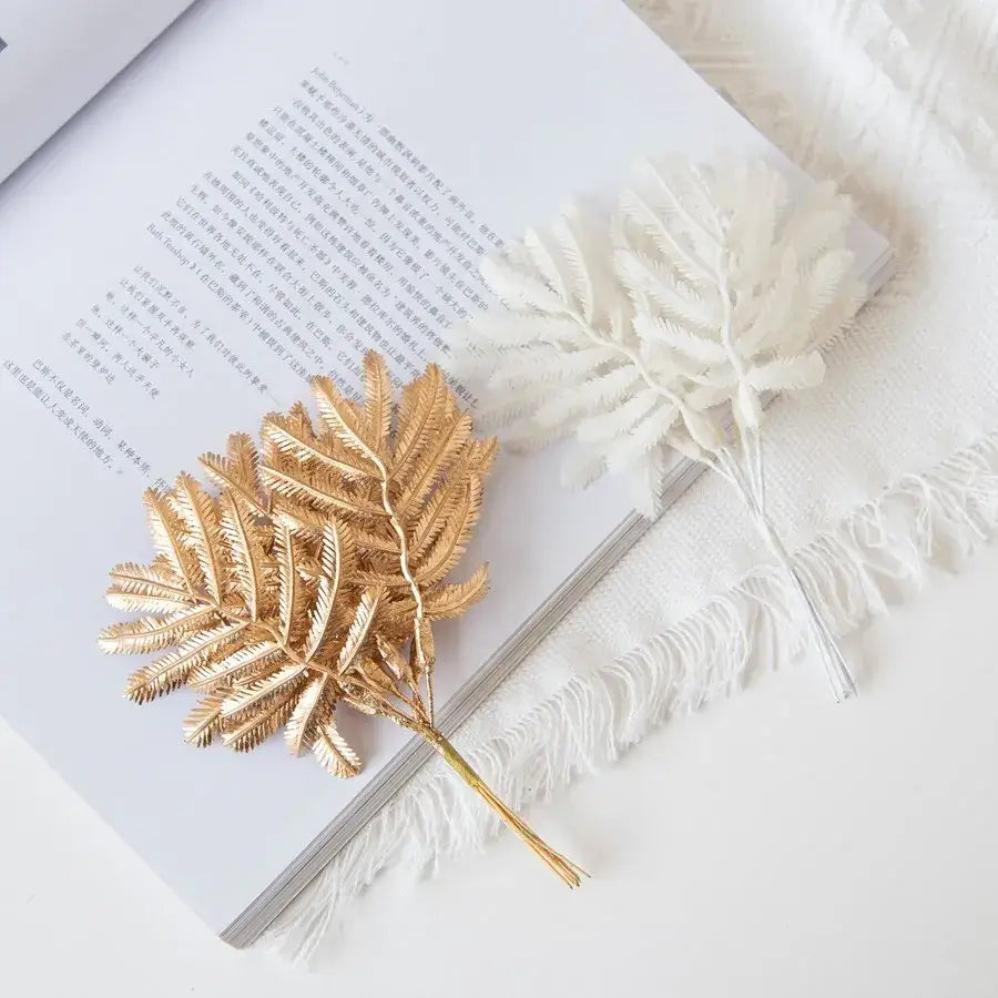 Gold metallic palm leaves hair accessory with intricate fronds and slender stem decorbites gold palm decorbites gold palm leaves