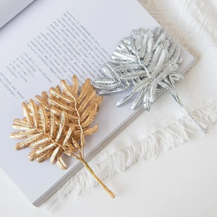 Two metallic palm leaves decorative pins in gold and silver for living room decorbites gold palm leaves decor