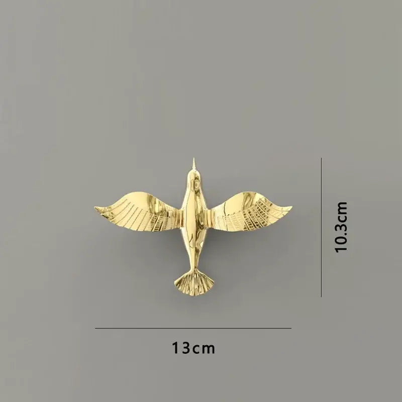 Gold-colored metal dove statue with detailed wing and tail feathers for living room pigeon wall decoration