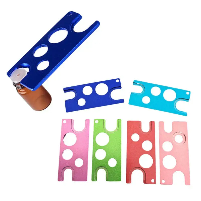 Blue anodized aluminum essential oils opener card holder with circular cutouts and spring-loaded mechanism for decorbites essential oils