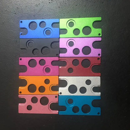 Set of eight colorful metallic essential oils opener tools with circular cutouts for kitchen storage decorbites essential oils