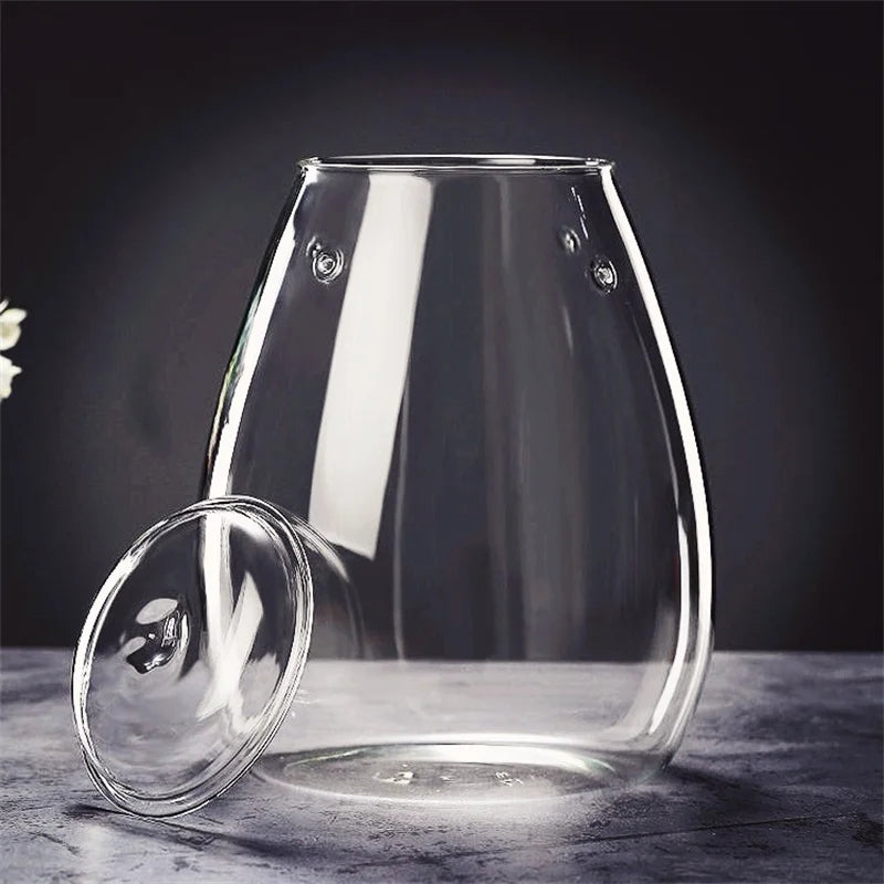 Clear glass tea infuser with matching lid and embossed circular details for micro landscape glass bottle decor