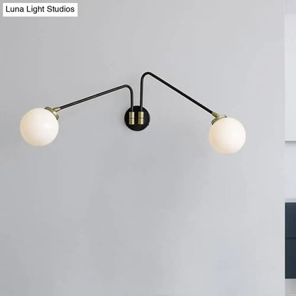 Mid century black and brass two-arm wall sconce with frosted opal glass globes compatible with e26 e27 bulbs