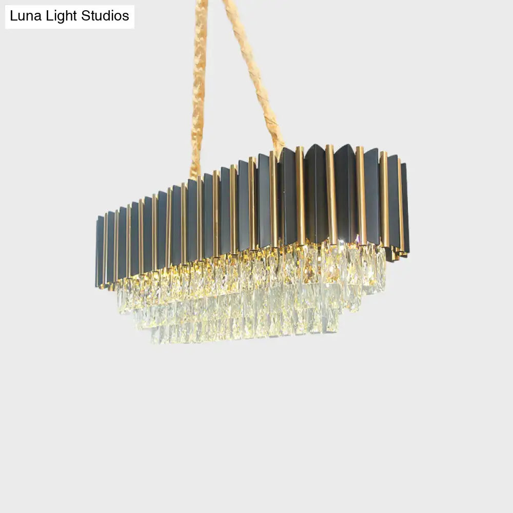 Modern rectangular light fixture with black and gold metallic bars and cascading clear crystals for dining rooms