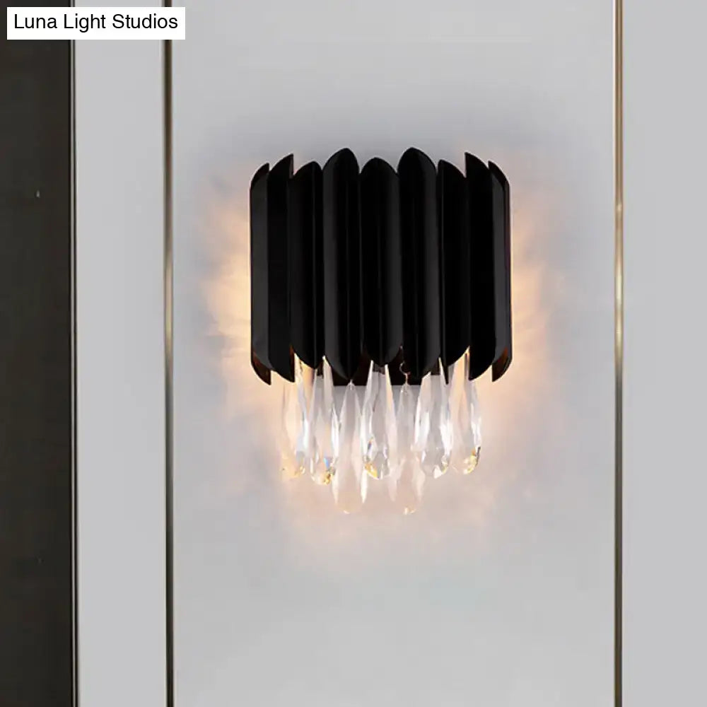 Mid century black metal wall sconce with cascading crystal droplets compatible with e12 light bulb for bedroom use