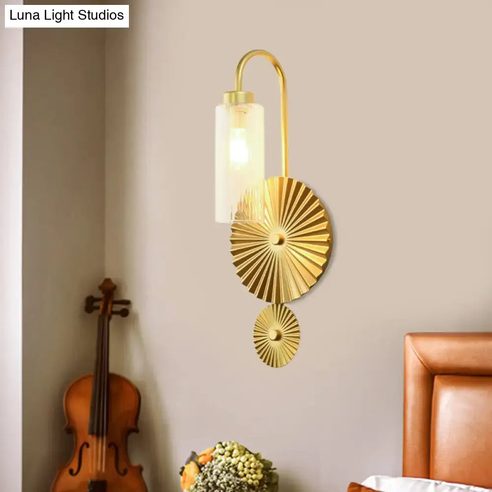 Mid century brass gooseneck wall lamp with gold-toned curved arm and frosted glass shade featuring descending fan plates