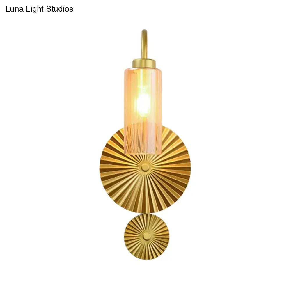 Mid century brass gooseneck wall lamp with gold finish amber glass shade and sunburst patterned metal discs