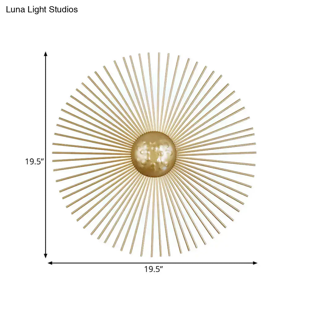 Mid century brass sunburst sconce light with gold toned metal fixture type features radiating spokes and central orb