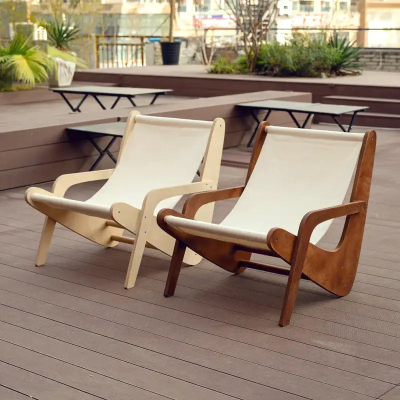 Two modern wooden mid-century decorbites canvas recliner chairs with cream seats in light and dark brown finishes