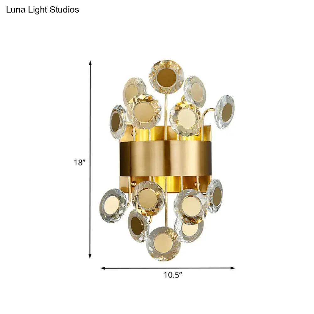 Mid century gold crystal wall light with integrated led features a cylindrical base with faceted crystal discs floral design
