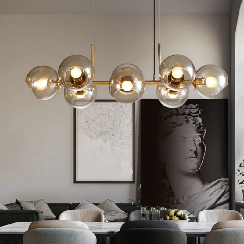 Modern gold metal mid-century chandelier with frosted smoked glass globes compatible with 110v-120v and 220v-240v led bulbs