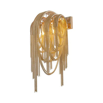 Gold-toned mid century wall lamp with silver stacked tassel design and sleek rectangular backplate for bedroom use