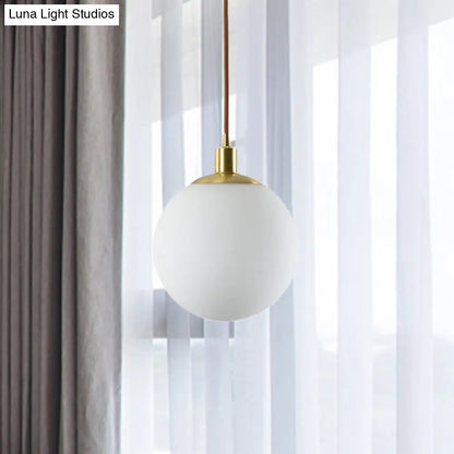 Milky Glass Ball Pendant Light: Modern LED Ceiling Lamp in Brass (6"/8"/10" Wide)