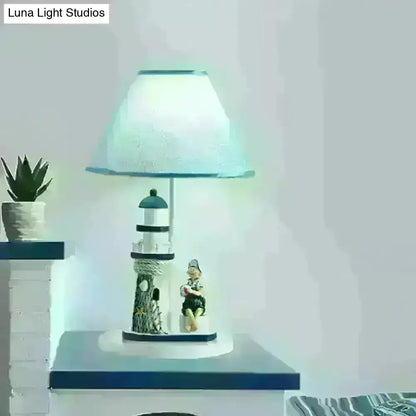 Minelava - Kids Conical Task Lighting Kids Style Fabric 1-Head Bedroom Table Light with Boy/Girl and Lighthouse Deco in Blue