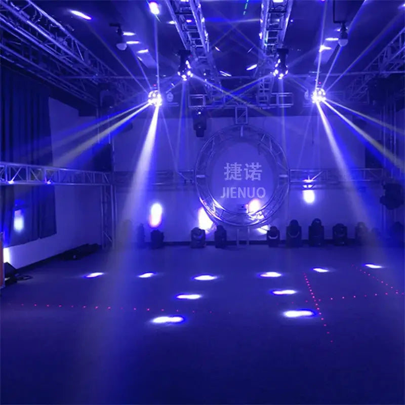 Blue stage lighting rig with multiple spotlights and red green laser light beams illuminating a circular backdrop in nightclub party room
