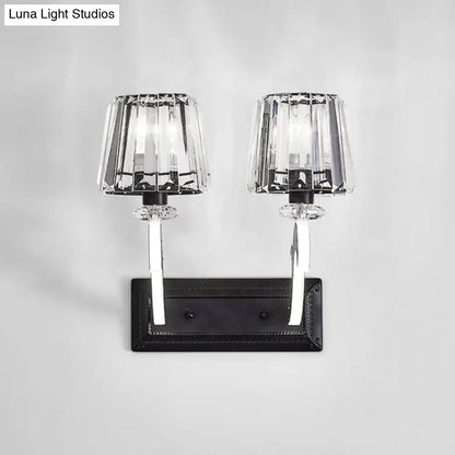 Minimal brass and crystal wall lamp with cone shade featuring elegant crystal sconce and black metal base for bedroom