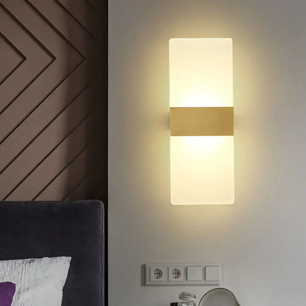 Minimalist acrylic gold wall sconce with frosted glass panels and a central gold-toned metallic accent wall lamp