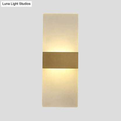Minimalist acrylic gold wall sconce with a warm diffused glow and central gold-toned metallic accent bar wall lamp
