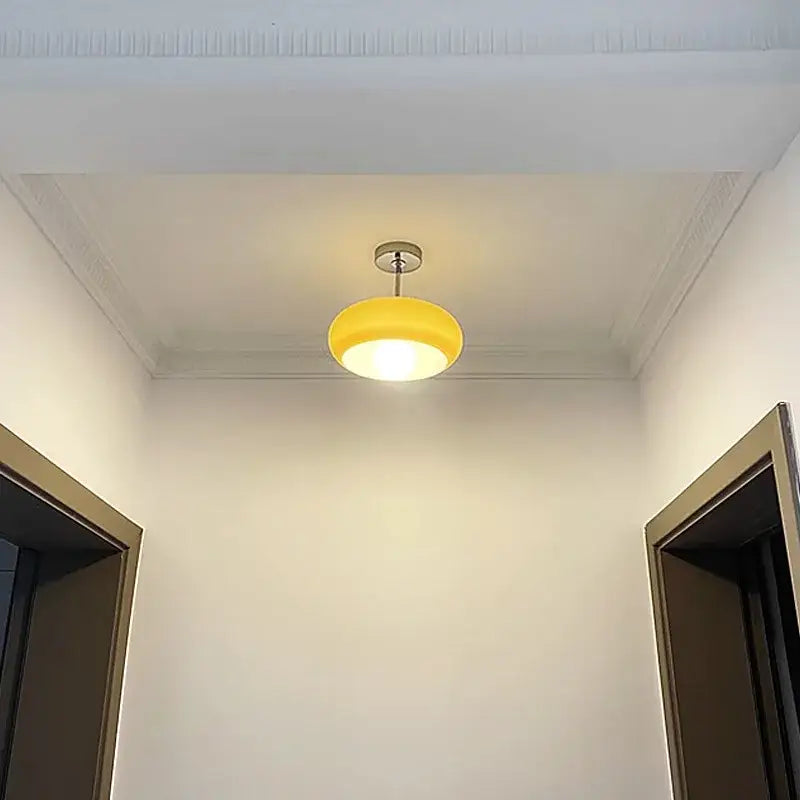 Minimalist amber glass copper led ceiling light with a modern yellow circular pendant design for hallway use