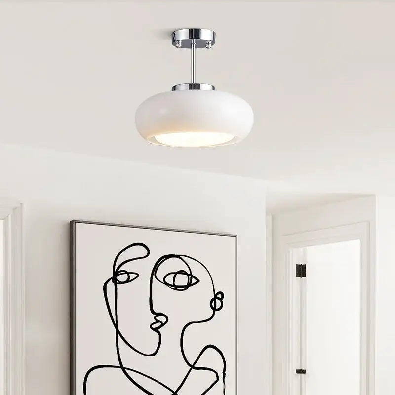 A minimalist amber glass copper led ceiling light with frosted dome and polished chrome hardware for hallway use