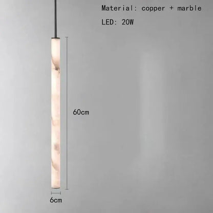 Minimalist amber marble and black pendant light with cylindrical body and polished copper accents for lighting area