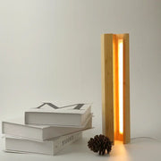 Minimalist decorbites bamboo pentagonal led desk lamp with warm vertical light strip between slender bamboo slats for reading