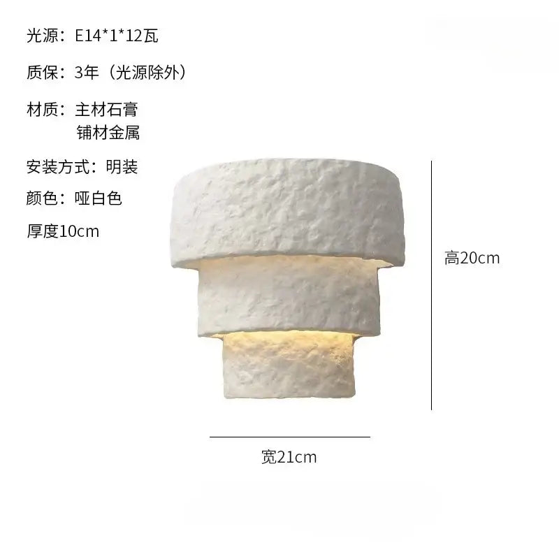 Minimalist bauhaus white gypsum wall lamp with textured plaster and metallic accents for warm bedroom lighting