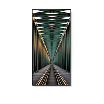 Framed photograph featuring a green steel truss bridge with railway tracks in a minimalist beige led wall lamp hallway art
