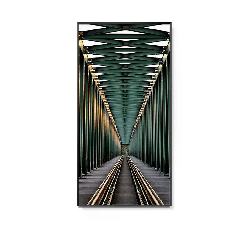Framed photograph featuring a green steel truss bridge with railway tracks in a minimalist beige led wall lamp hallway art