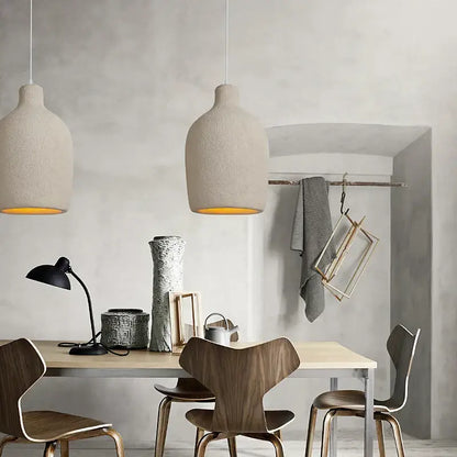 Minimalist beige decorbites cement chandelier light featuring two textured ceramic pendant lights with warm interiors