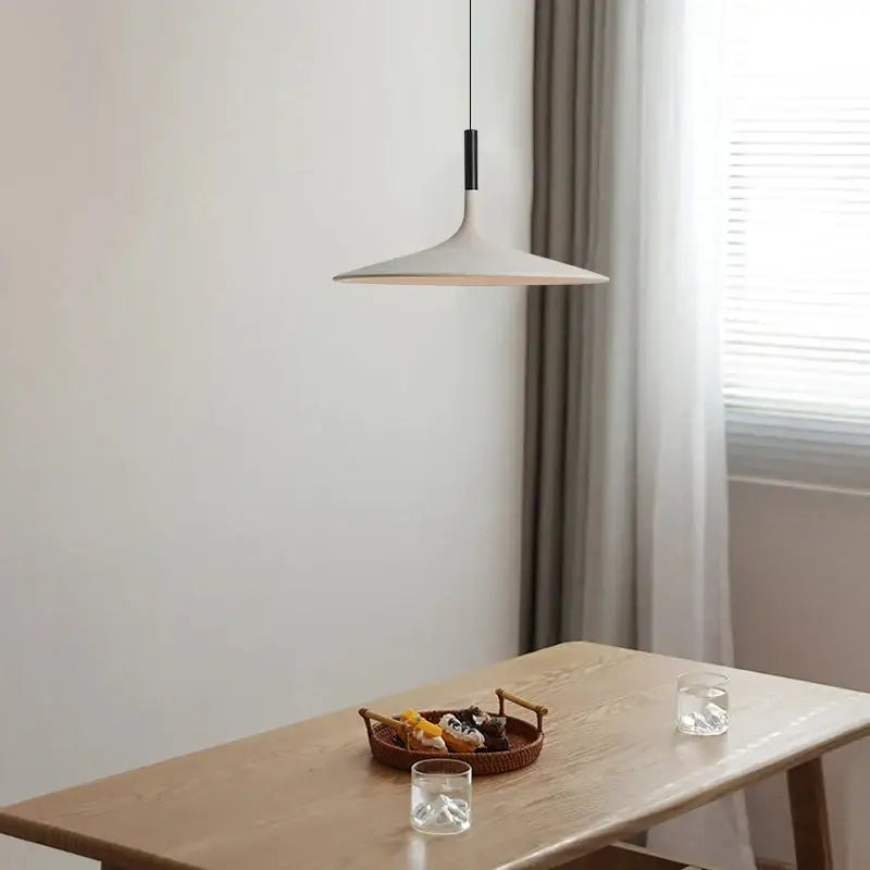 Minimalist beige decorbites cement ufo led pendant light with flared white shade and black rod for dining room lighting