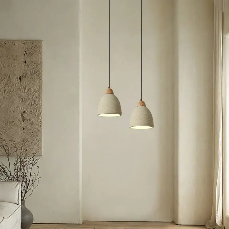 Two minimalist beige decorbites cement led pendant lights with ceramic shades and wood accents for kitchen decor