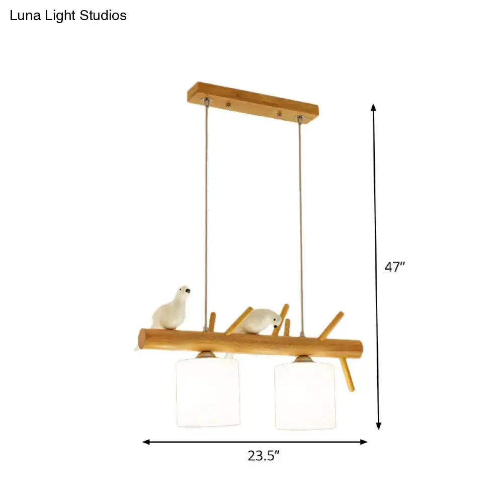 Decorbites™ beige drum island lighting with natural wood branch design, white ceramic birds, and frosted glass shades