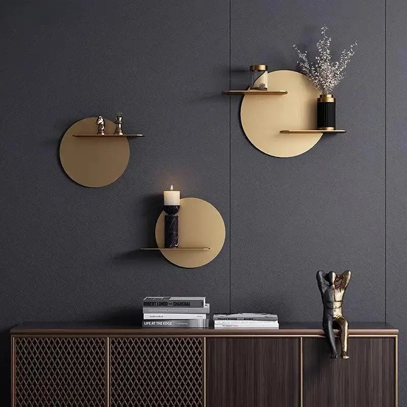 Gold-toned circular minimalist metal wall storage shelf in beige for modern living room wall storage solutions