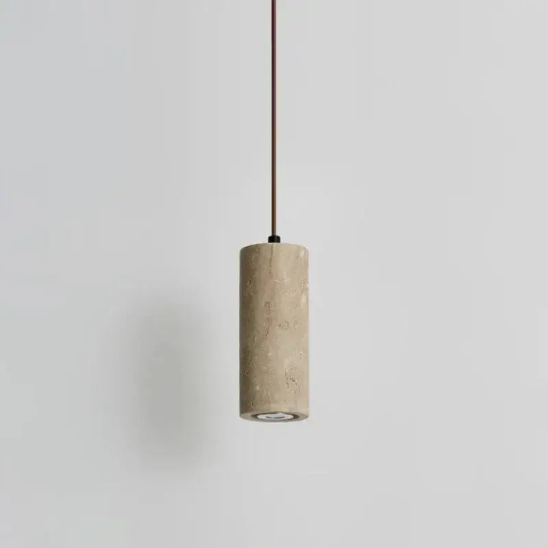 Minimalist beige travertine cylindrical pendant light with textured stone finish and slender brown cord for dining table