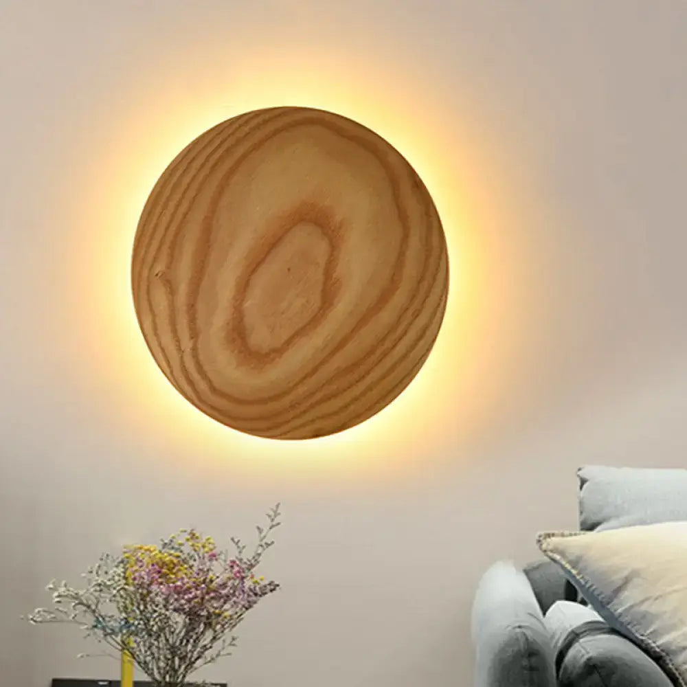 Minimalist beige wood circle led bulb wall sconce with natural grain and warm ambient lighting for parlor use