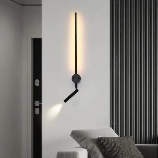 Minimalist black wall lamp with adjustable angle arm and sleek vertical bar emitting warm light by decorbites adjustable angle