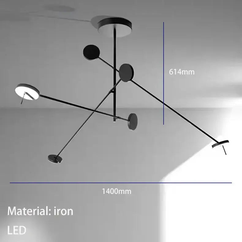 Black iron wall lamp with five circular led lights featuring an adjustable swing arm in a modern asymmetrical design