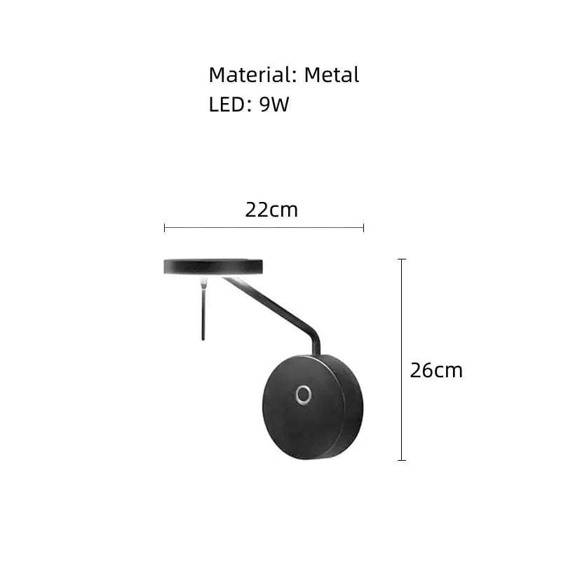 Black metal wall lamp with sleek curved arm and circular base featuring an adjustable swing arm for bedroom use