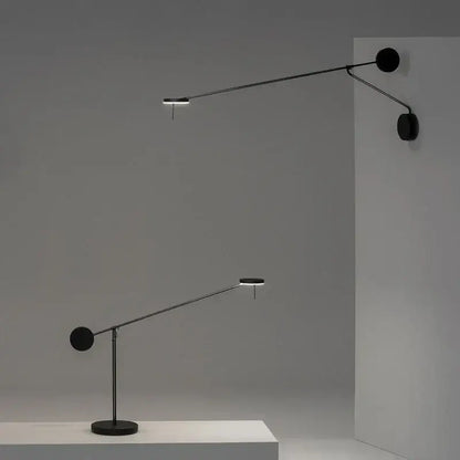 Minimalist black wall lamp with adjustable swing arm and sleek articulated design for bedroom lighting