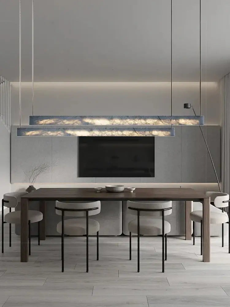 Minimalist black and amber marble design pendant light with warm internal lighting for office use