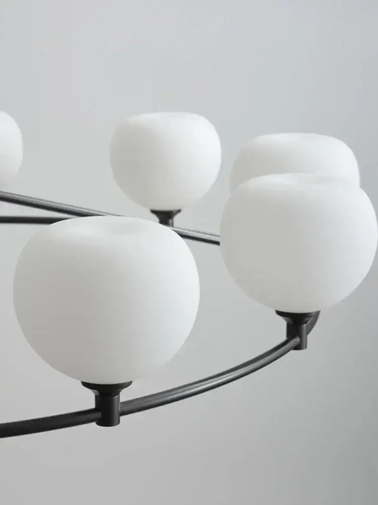 Minimalist black and copper glass chandelier with frosted white globe shades for dining room decorbites copper glass design