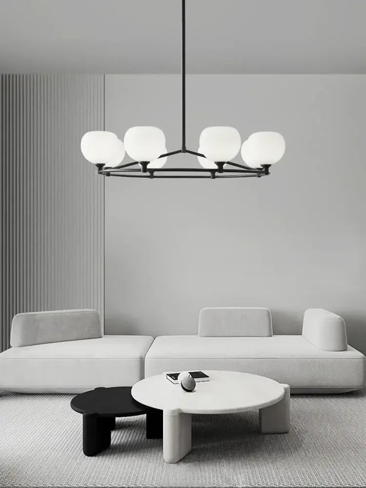 Minimalist black metal chandelier with five frosted globes featuring decorbites copper glass chandelier design