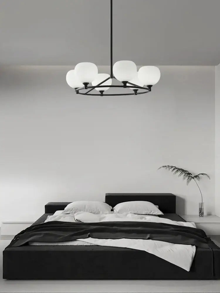 Minimalist black metal copper glass chandelier with six frosted globe lights for dining room decorbites copper glass lighting
