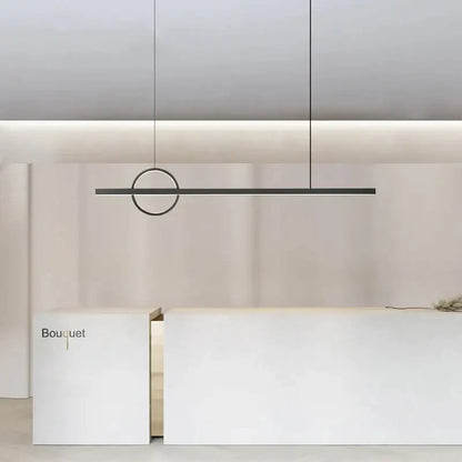 Minimalist black and geometric copper chandelier dining room light with circular accent above white reception desk decorbites geometric copper