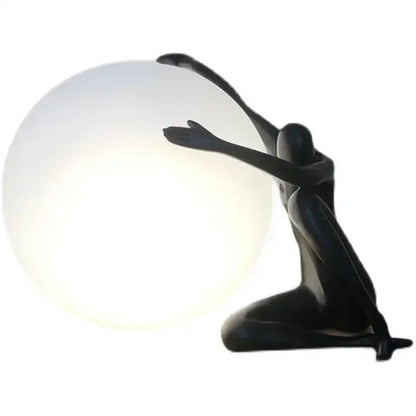 Minimalist black and white decorbites humanoid sculpture led table lamp with a glowing spherical globe for bedroom decor